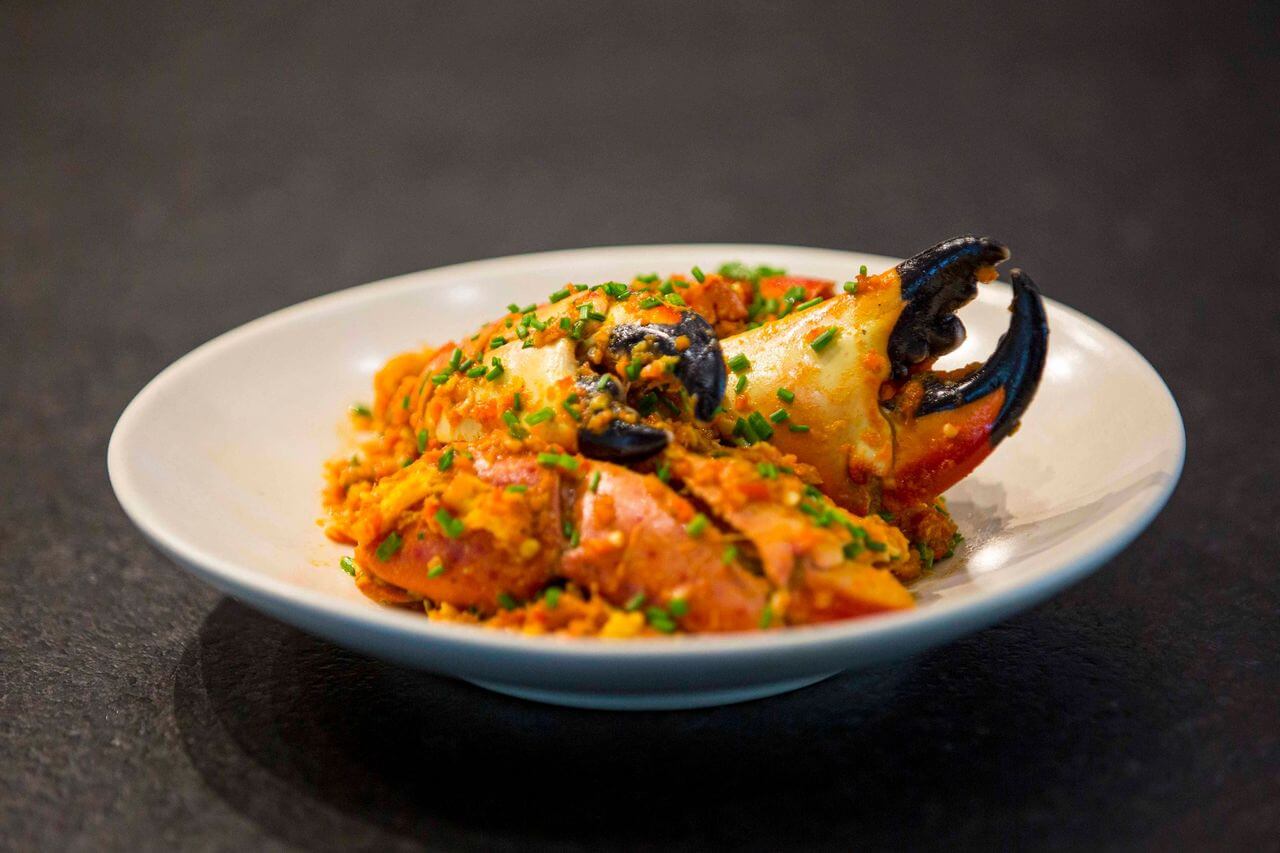 Manitas de cangrejo estilo chili crab